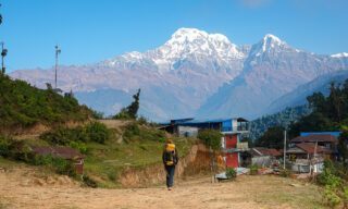 First day of trekking on the Mardi Himal trek with Annapurna South towering in the skyline during the Fishtail Mountain Trek with Life Happens Outdoors