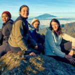 Life Happens Outdoors female trekkers on the Kilimanjaro trail from Shira Camp to Lava Tower, soaking in a stunning sunrise.