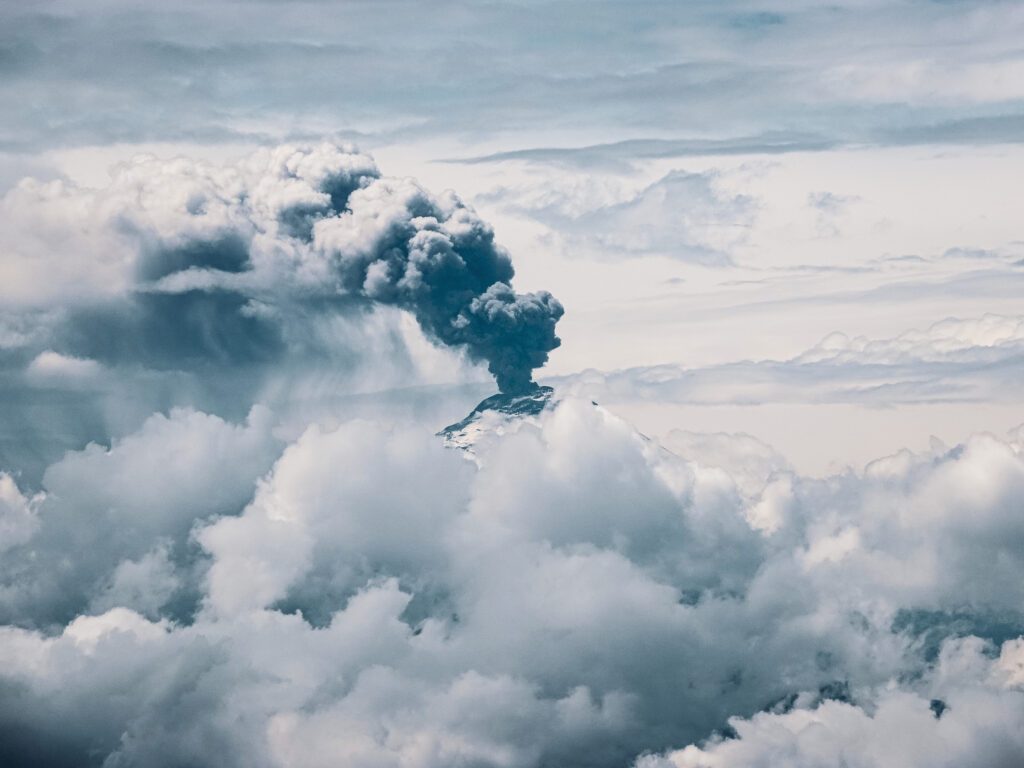 Cotopaxi erupting between the clouds as seen by the Life Happens Outdoors team from Rucu Pichincha during the Climb Cotopaxi & Climb Chimborazo Expedition.