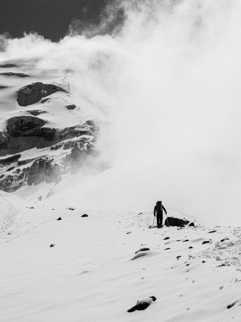 LHO guide Jorge Coronel ascending to Chimborazo Base Camp on the snow ridge during the Climb Cotopaxi & Climb Chimborazo Expedition with the Life Happens Outdoors team.
