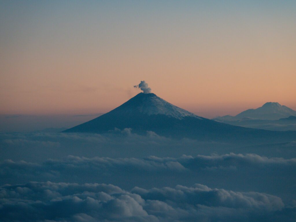 Sulfur cloud rising from the Cotopaxi crater as seen at sunrise from the summit of Chimborazo during the Climb Cotopaxi & Climb Chimborazo Expedition with the Life Happens Outdoors team.