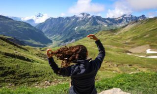 The Life Happens Outdoors team reaching the Beaufortain above Les Chapieux during the Tour du Mont Blanc (TMB).