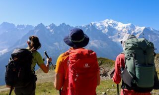 The Life Happens Outdoors team at the Col de Balme on the French-Swiss border during the Tour du Mont Blanc (TMB).