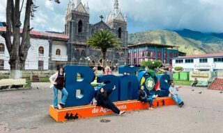 LHO adventurers enjoying a guided city tour of Baños, exploring local streets, markets, and vibrant Ecuadorian culture.