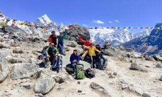The Life Happens Outdoors Team celebrating their achievement on the Everest Base Camp Trek