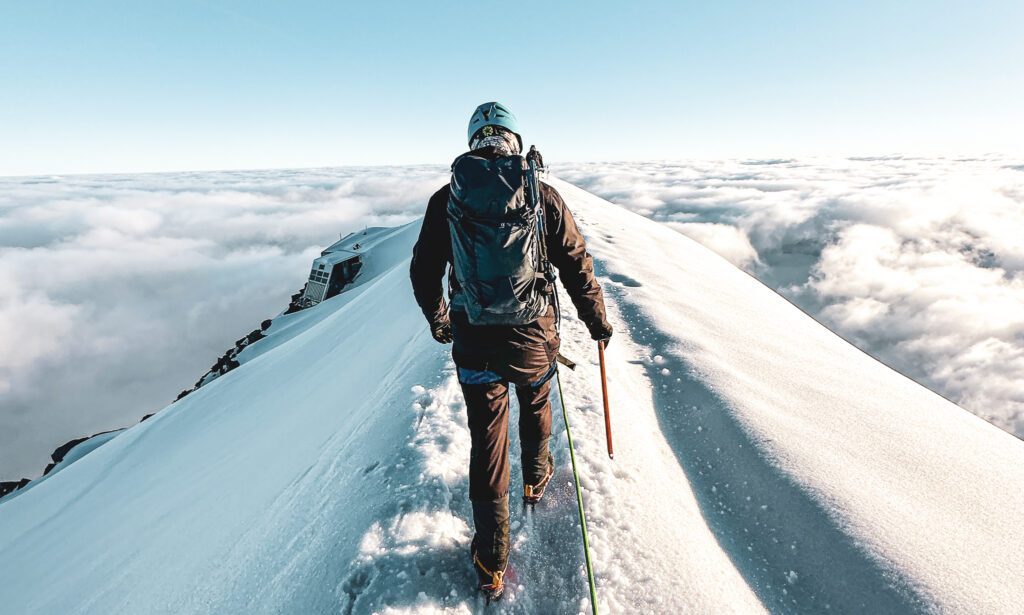 Crossing the Aiguille du Gouter ridge on the descent from Mont Blanc during the Mont Blanc Summit Climb course with the Life Happens Outdoors team.