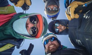 LHO team on the summit of Mount Kazbek alongside IFMGA-certified guides and Team Leader Bader