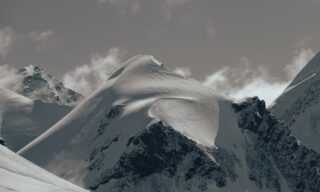 A beautiful landscape photo of the Lyskamm and Castor as seen from the Pollux, taken by LHO Founder and Team Leader Rami Rasamny during the Spaghetti Tour Expedition Climb Monte Rosa with the Life Happens Outdoors team.