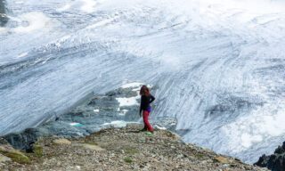 LHOer Hened Choueiry enjoying a view of the Arolla Glacier from above the Cabane des Vignettes during the Chamonix to Zermatt Haute Route Expedition with the Life Happens Outdoors team.
