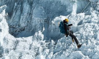 LHO climber descending on the abseil from the final headwall, leading back from the summit ridge of Lobuche East.