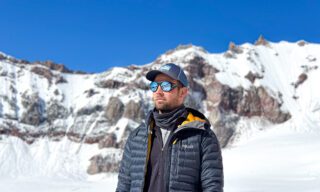 LHO team relaxing outside the Mount Kazbek refuge in amazing weather ahead of the summit push