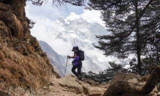 A Life Happens Outdoors team member trekking on the Everest Base Camp Trek