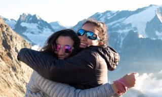 LHOers Ray Yafi and Hanan enjoying the view from the spectacular Cabane de Bertol, high above the Arolla Valley, during the Chamonix to Zermatt Haute Route Expedition with the Life Happens Outdoors team.