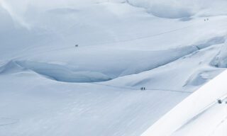 Crossing the North Face route on Mont Blanc on the way to the summit during the Mont Blanc Summit Climb course with the Life Happens Outdoors team.