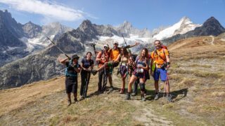 The Life Happens Outdoors team at the Grand Col Ferret, getting ready to head down to the charming town of Courmayeur during the Tour du Mont Blanc (TMB).