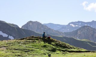 The Life Happens Outdoors team having a picnic at the Col de la Croix de Bonhomme during the Tour du Mont Blanc (TMB).