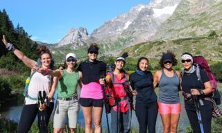 The Life Happens Outdoors team crossing the lakes of the Val Veny on the Italian side of Mont Blanc near Courmayeur during the Tour du Mont Blanc (TMB).