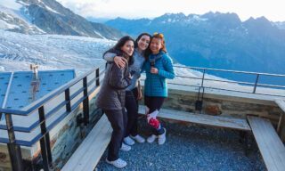 LHOers Catherine Choy and Ray Yafi at the Albert 1ère Hut, enjoying the sunset above the Le Tour Glacier during the Chamonix to Zermatt Haute Route Expedition with the Life Happens Outdoors team.