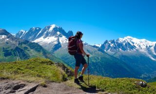 The Life Happens Outdoors team at Les Possettes above the town of Le Tour, with Mont Blanc and the Chamonix Valley in the background during the Tour du Mont Blanc (TMB).