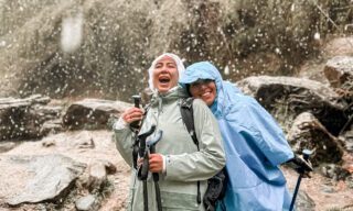 The Life Happens Outdoors team enjoying the snowfall between Dovan and Annapurna Base Camp during the Annapurna Base Camp Trek.