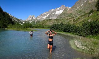 The Life Happens Outdoors team taking a refreshing dip in the lakes of Val Veny on the Italian side of Mont Blanc during the Tour du Mont Blanc (TMB).