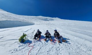LHO team led by Team Leader Bader enjoying clear weather just above the saddle during descent from Mount Kazbek summit