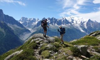 The Life Happens Outdoors team just below Lac Blanc, descending to Argentière with the Mer de Glace in the background during the Tour du Mont Blanc (TMB).