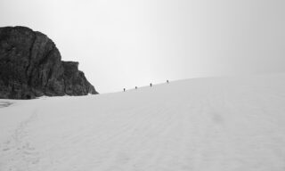Rope party approaching the Col de l'Évêque above the Arolla Glacier on the way to Cabane de Bertol from Cabane des Vignettes during the Chamonix to Zermatt Haute Route Expedition with the Life Happens Outdoors team.