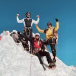 LHO summiteers Zeid Shair and Melissa Jefferies celebrating on the summit of Lobuche East, with stunning panoramic views of the Himalayas in the background.