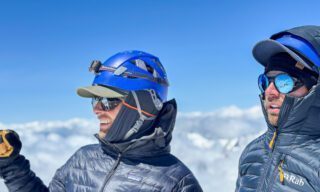 LHO team members celebrating under clear skies on the summit of Mount Kazbek