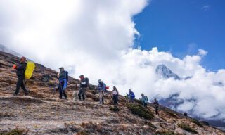 The Life Happens Outdoors team trekking in the Khumbu Valley during the Everest Base Camp Trek
