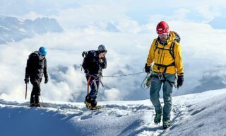 Crossing the ridge of the Aiguille de Gouter on the way to the summit during the Mont Blanc Summit Climb course with the Life Happens Outdoors team.