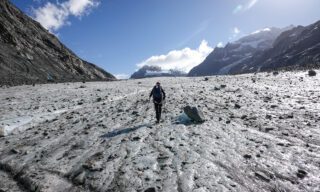 LHOer walking on the dry Otemma Glacier on the way to Cabane des Vignettes during the Chamonix to Zermatt Haute Route Expedition with the Life Happens Outdoors team.