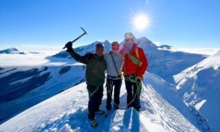 IFMGA guide and Piolet d'Or winner Fred Degoulet on the summit of the Pollux during the Spaghetti Tour Expedition Climb Monte Rosa with the Life Happens Outdoors team.