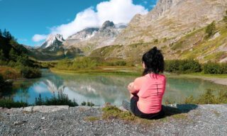 LHO Ambassador Romy Habre enjoying the view of the Val d'Entrèves on the Italian side of Mont Blanc during the Tour du Mont Blanc (TMB).