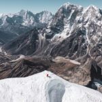 LHO climber beneath the summit of Lobuche East, waiting for the guide to assist on the final fixed rope to the summit, with the stunning Pheriche Valley below.