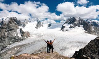 LHOers enjoying the incredible view above Cabane des Vignettes with the Arolla Glacier in the background during the Chamonix to Zermatt Haute Route Expedition with the Life Happens Outdoors team.