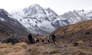 Life Happens Outdoors team members making their way to Annapurna Base Camp from Machapuchare Base Camp during the Annapurna Base Camp Trek.