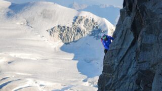IFMGA guide Philippe Genin leading on the Dent du Géant with the Vallée Blanche in the background, as seen from the Salle à Manger during the Climb Matterhorn Course with the Life Happens Outdoors team.