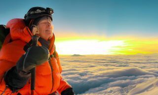 Milly Larmer on Cotopaxi, realizing that the summit is just moments away during the Climb Cotopaxi & Climb Chimborazo Expedition with the Life Happens Outdoors team.