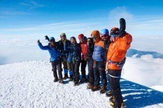 The Life Happens Outdoors team on the summit of Cotopaxi during the Climb Cotopaxi & Climb Chimborazo Expedition.