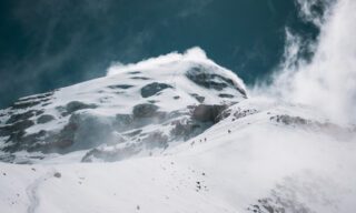 Heading to Chimborazo Base Camp with the Ventimilla summit appearing through the clouds during the Climb Cotopaxi & Climb Chimborazo Expedition with the Life Happens Outdoors team.