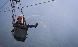 Life Happens Outdoors adventurer experiencing zip lining in Pokhara during a Nepal adventure tour