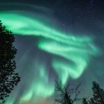 The Doughan family enjoying the northern lights on the Arctic island of Senja during the Family Adventures: Chase the Northern Lights with the Life Happens Outdoors team.