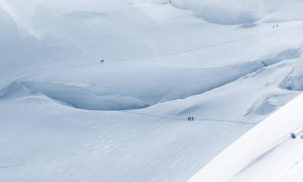 Crossing the North Face of Mont Blanc on the way to the summit during the Mont Blanc Summit Climb course with the Life Happens Outdoors team.