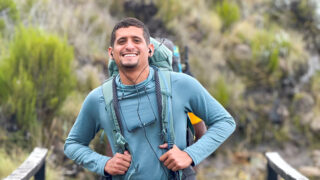 Life Happens Outdoors climber nearing Horombo Hut on the Kilimanjaro trail after ascending from Mandara Hut.