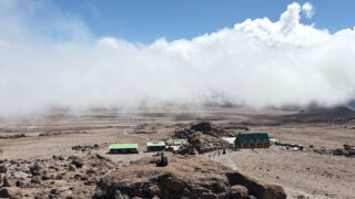 View of Kibo Hut from above during the descent from Gilman’s Point on Kilimanjaro, following the summit of Uhuru Peak.