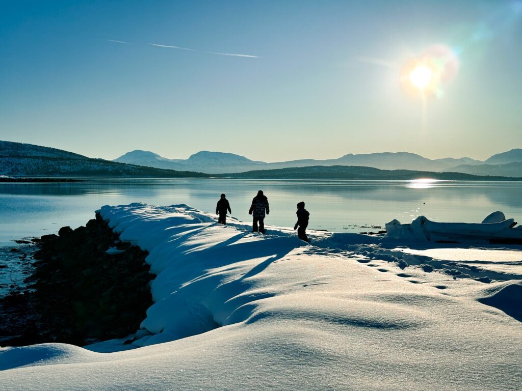 The Doughan family exploring the fjords on the Arctic island of Senja during the Family Adventures: Chase the Northern Lights with the Life Happens Outdoors team.