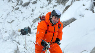 LHO climber Masha descends the Yellow Tower below Camp 2 during snowy conditions on the Climb Ama Dablam Expedition with Life Happens Outdoors.