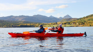 LHO team kayaking on the fjords off the coast of Senja during the Norway Arctic adventure
